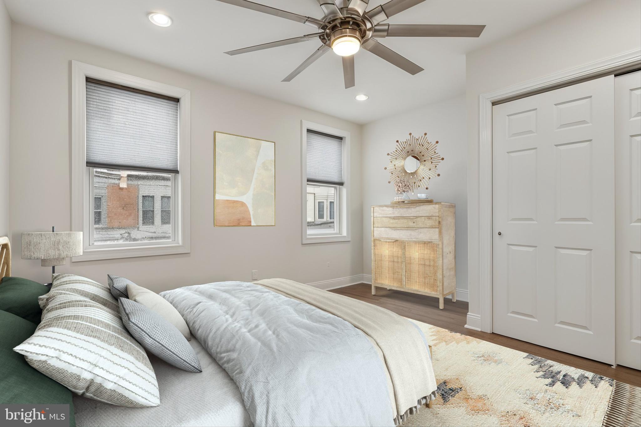 5121 Hadfield Street Philadelphia, PA 19143 - Photo 15 of 19 a bedroom with a bed and wooden floor