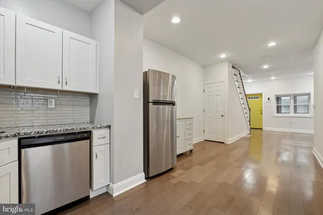 a view of a kitchen with electric appliances