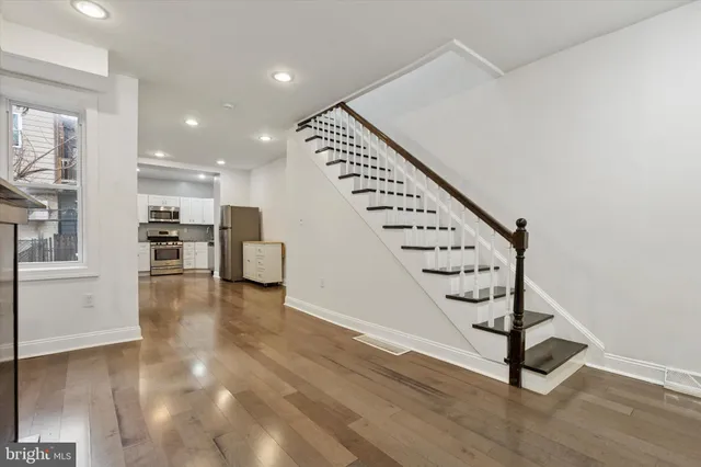 a view of entryway with wooden floor