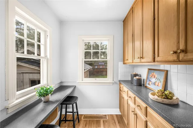 a kitchen with a window a sink and cabinets