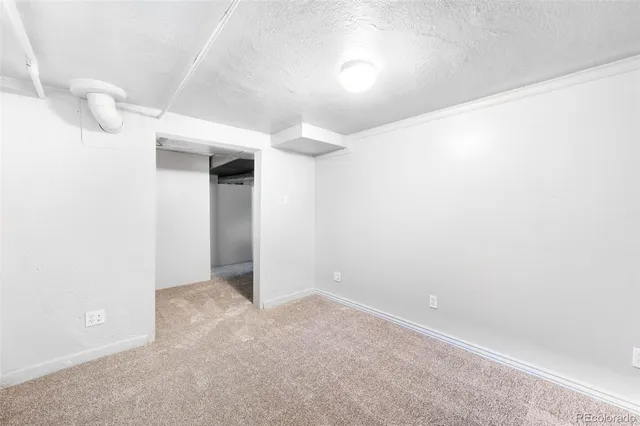 a view of empty room with wooden walls