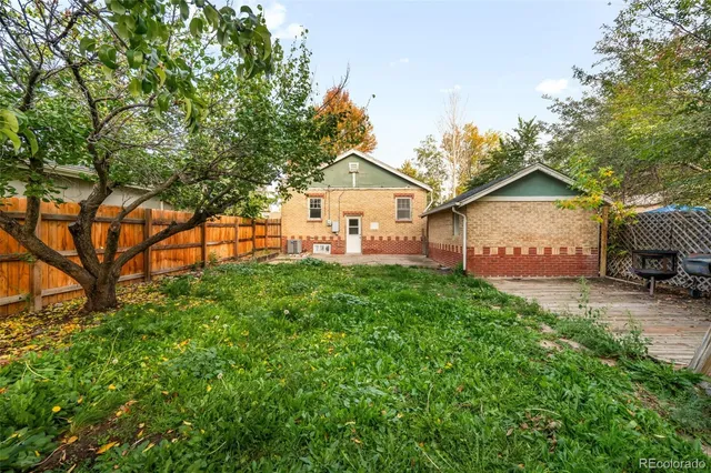 a picture of a bench in front of a wall