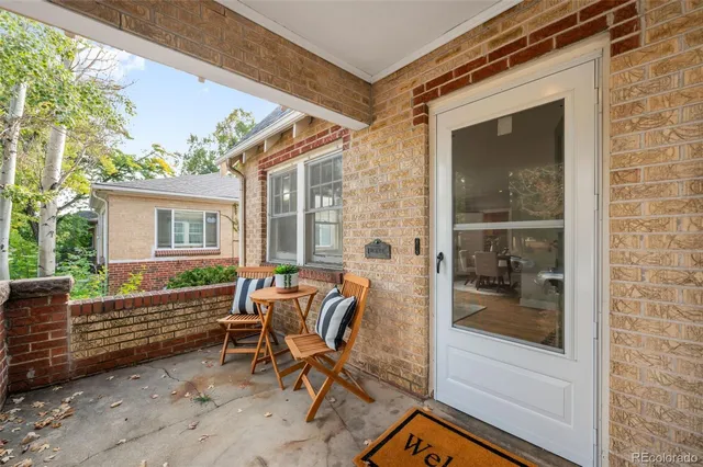 a view of two chairs in the balcony