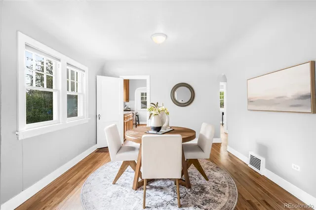 a dining room with furniture and window