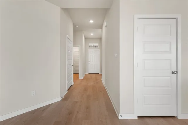 a view of kitchen with a sink stainless steel appliances and cabinets