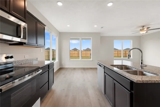a view of an empty room and fire place