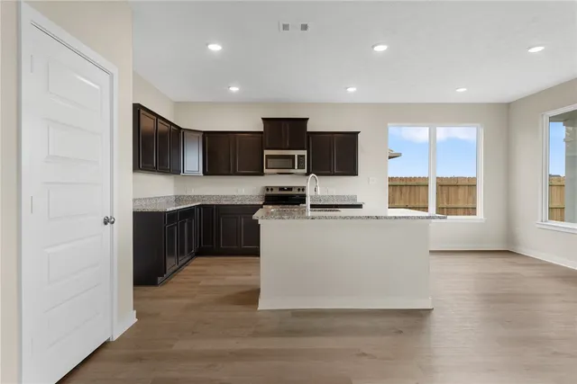 a bathroom with a bathtub and a sink