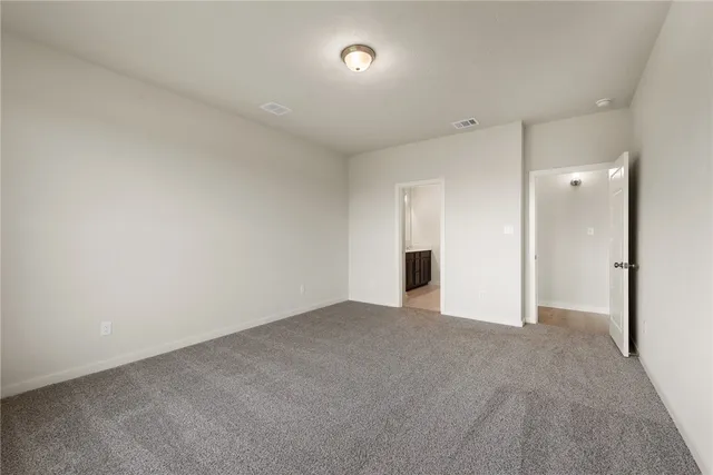 a bathroom with a shower sink and mirror