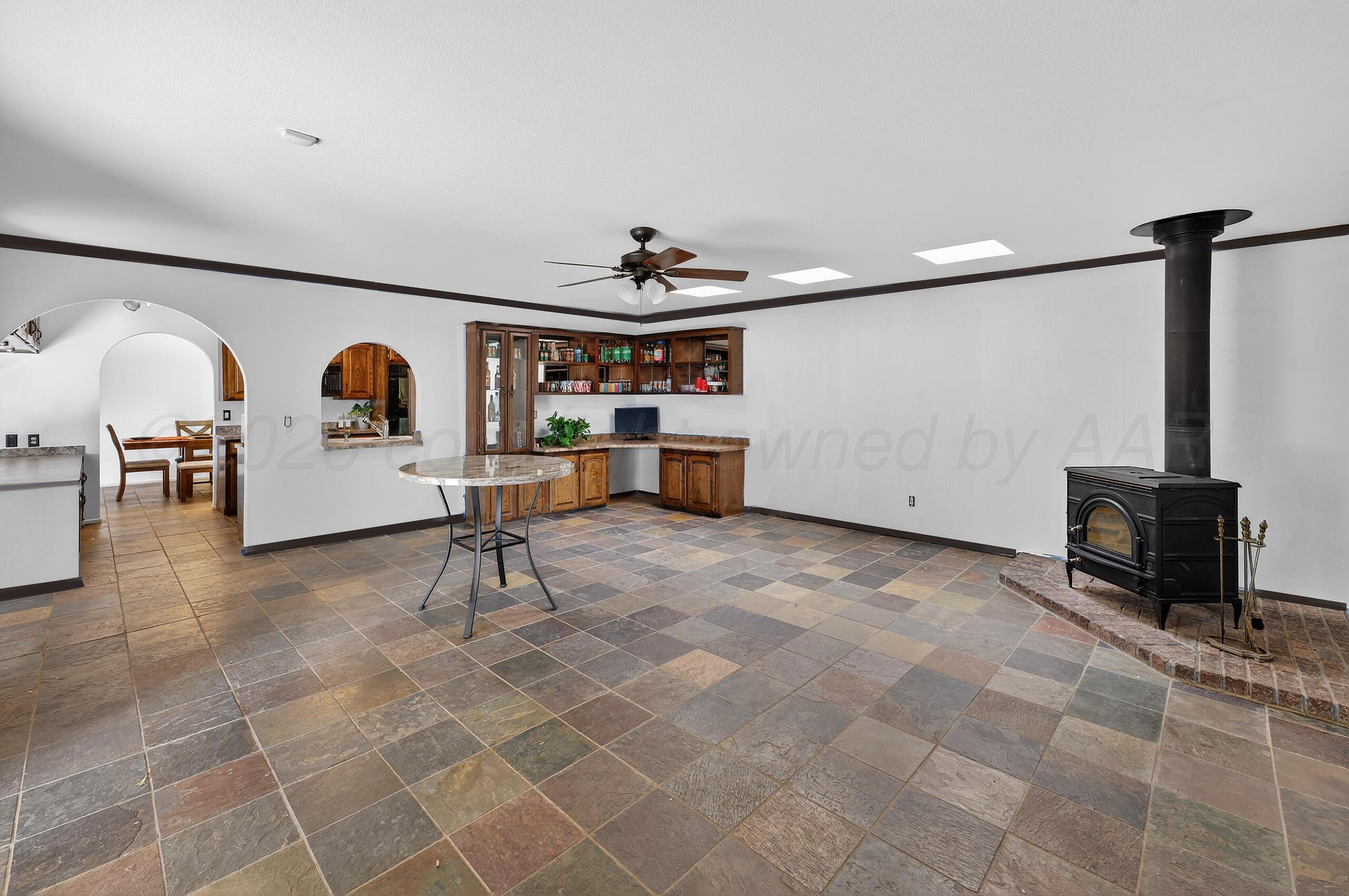 6307 Fulton Drive Amarillo, TX 79109 - Photo 9 of 23 a living room with furniture and a flat screen tv