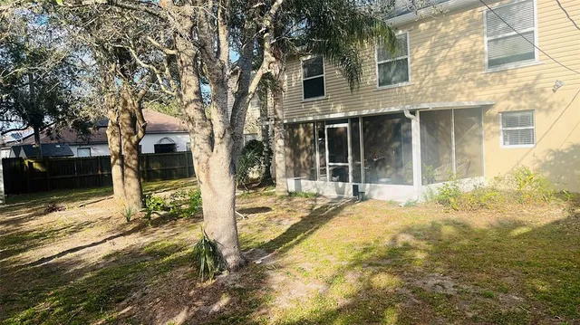 a view of a house with snow on the road