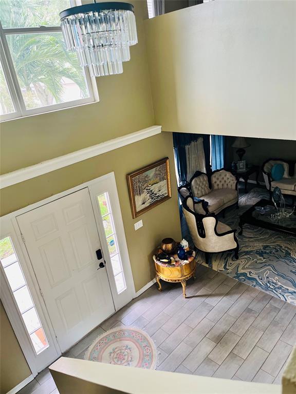 184 Massini Avenue Northwest Palm Bay, FL 32907 - Photo 2 of 15 a living room with furniture and a window