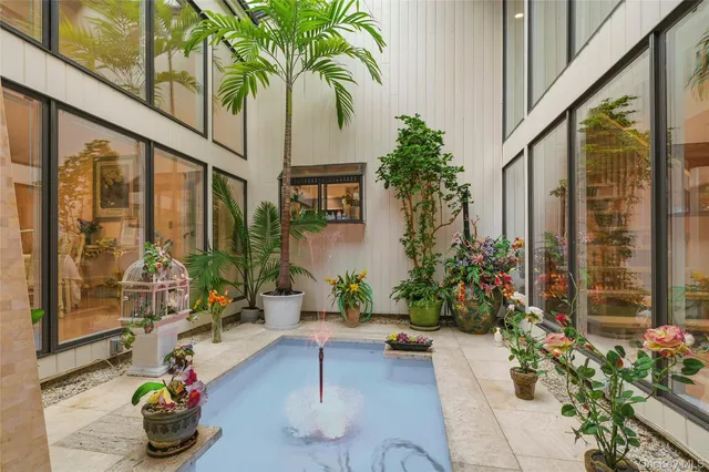a living room filled with furniture and flowers