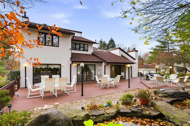 a front view of a building with outdoor seating