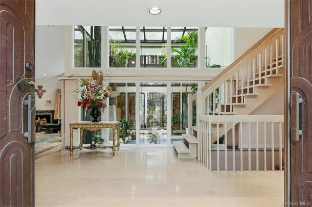 a view of hall way with furniture