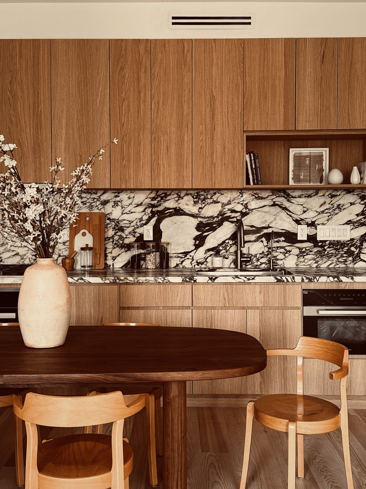 a kitchen with a table and chairs