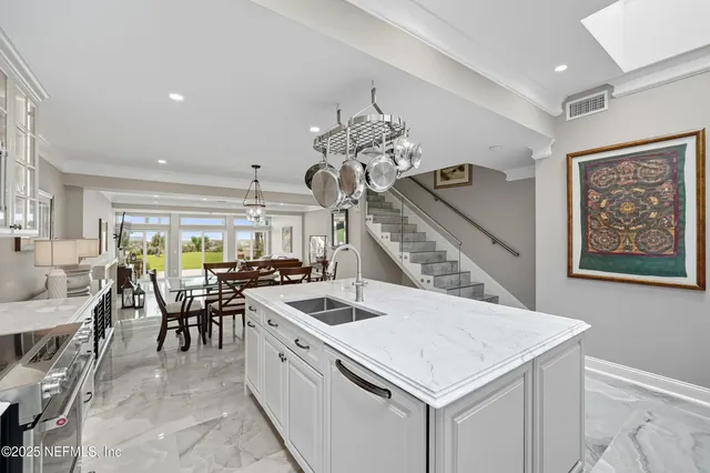 a bedroom with a large bed couches and closet
