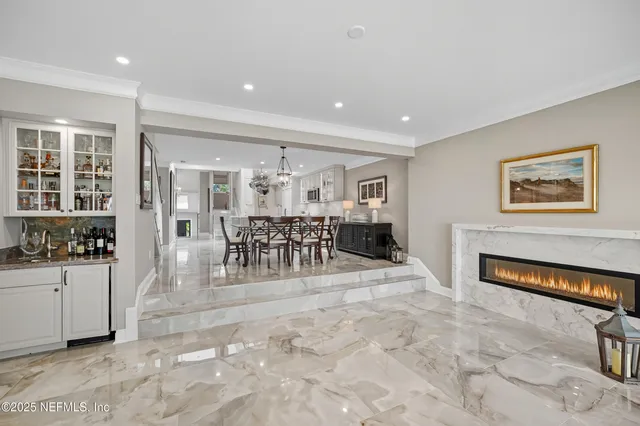 a spacious bathroom with a granite countertop sink mirror and a bath tub