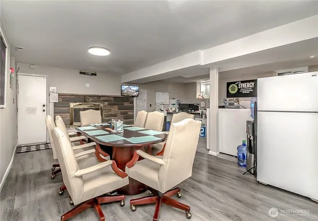 a view of a dining room with furniture and a wooden floor