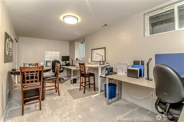 a view of a workspace with furniture