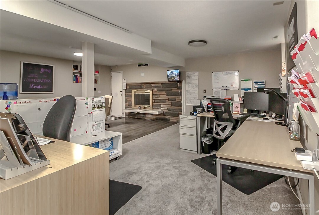 1005 28th Street Southeast, Unit C Auburn, WA 98002 - Photo 16 of 23 a view of a dining room with furniture and a flat screen tv