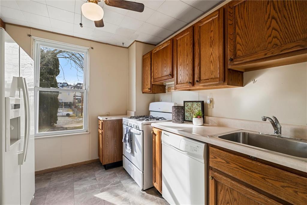 325 Walnut Street Vandergrift, PA 15690 - Photo 6 of 29 a kitchen with a sink cabinets and window