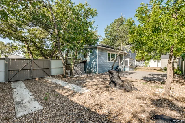 a house with trees in front of it