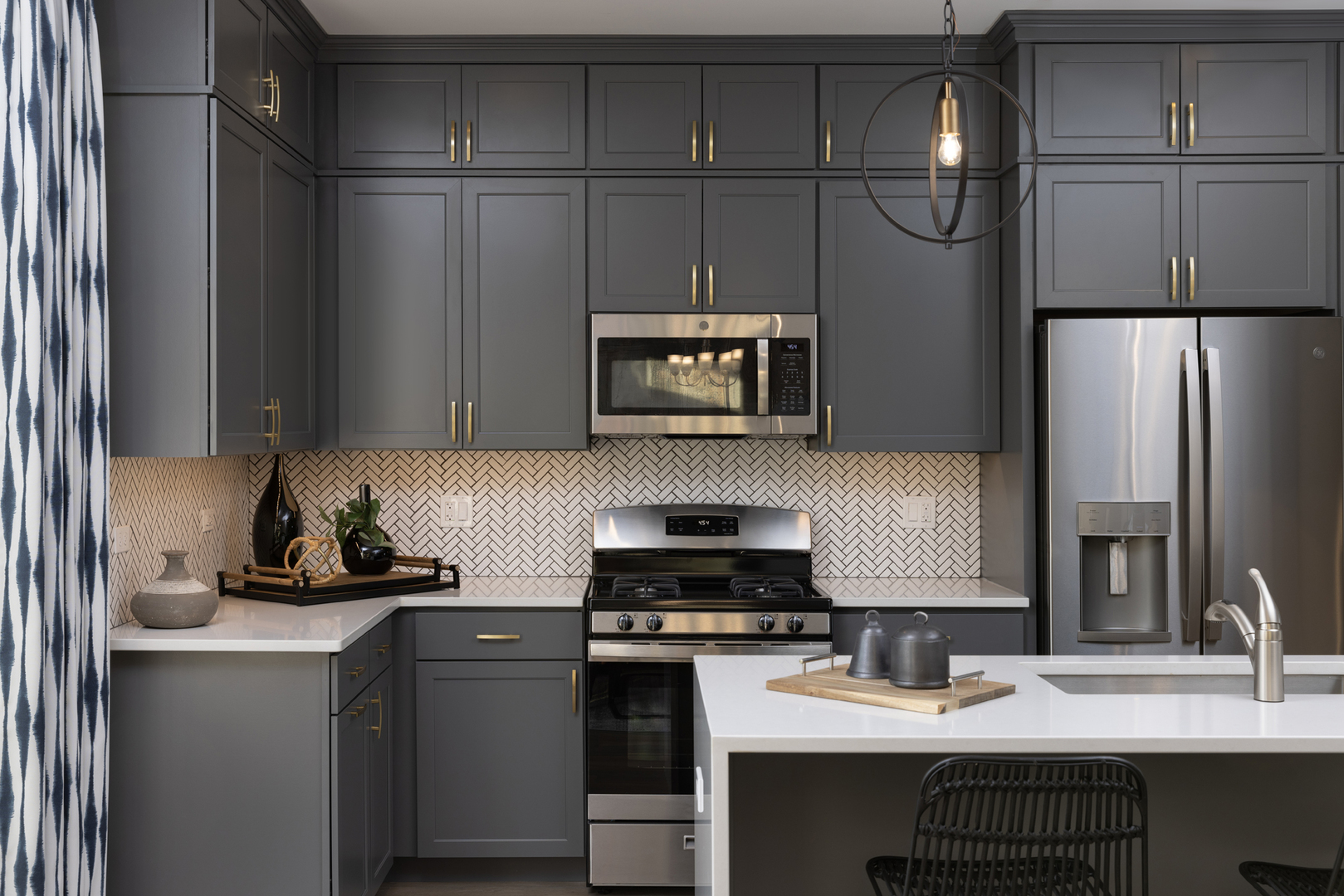 303 Timberleaf Circle Roselle, IL 60172 - Photo 3 of 8 a kitchen with a sink cabinets and stainless steel appliances