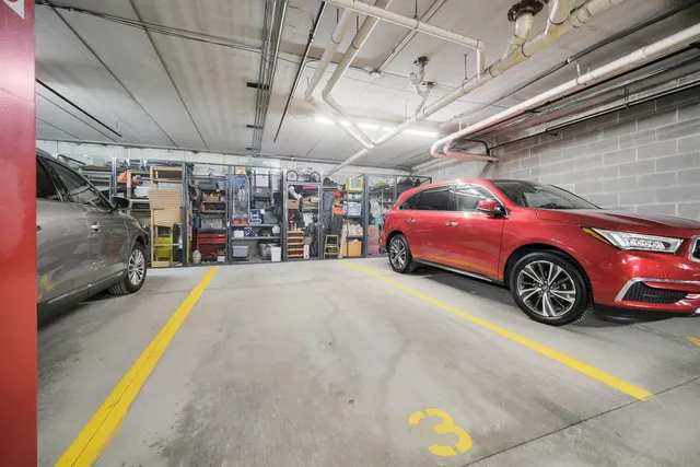 a view of parking garage with cars