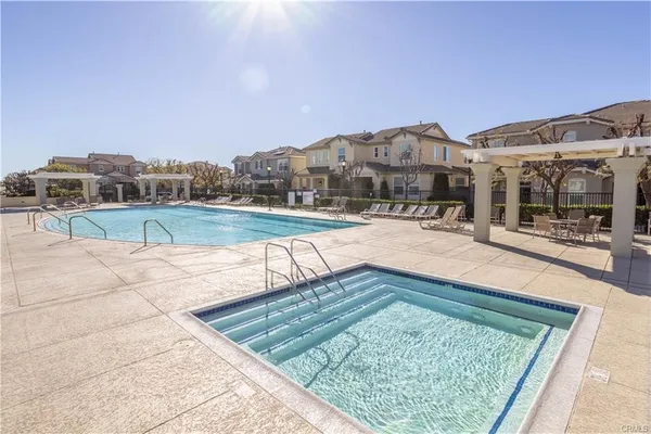a view of a swimming pool with a lounge chairs