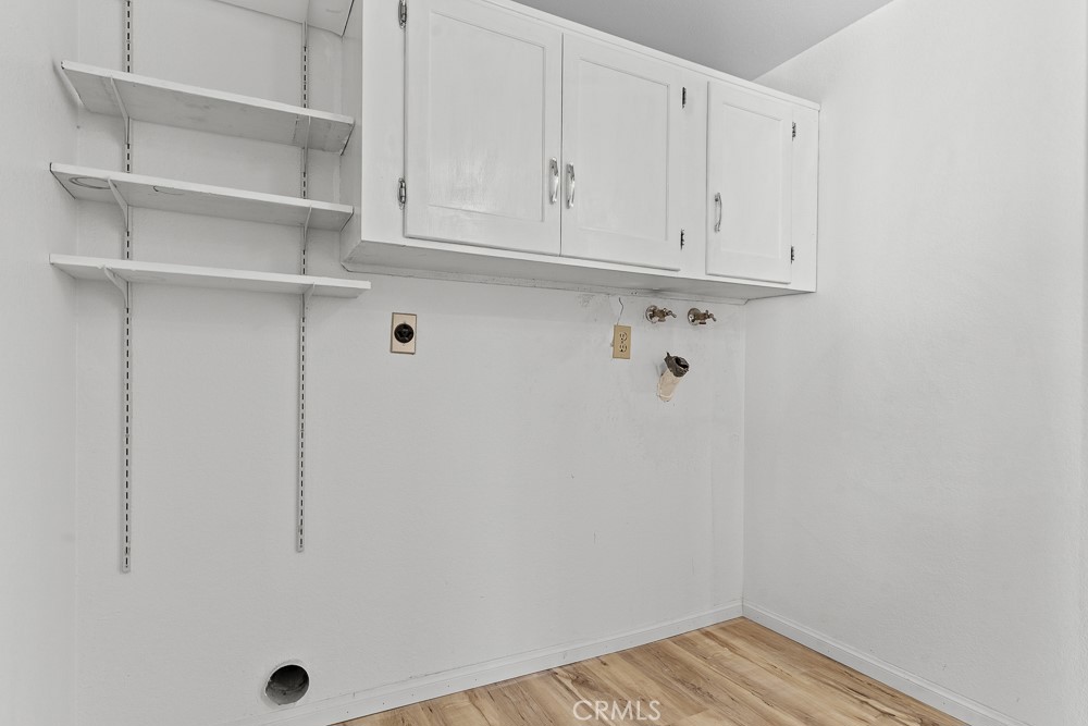 21921 Rimhurst Drive, Unit 128 Lake Forest, CA 92630 - Photo 14 of 24 a view of cabinets