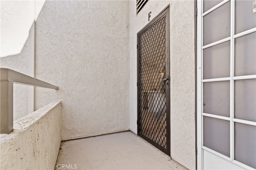 21921 Rimhurst Drive, Unit 128 Lake Forest, CA 92630 - Photo 24 of 24 a view of a hallway with staircase