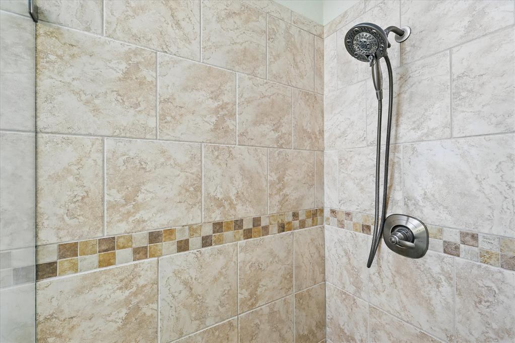 14625 Windsor Court Addison, TX 75001 - Photo 24 of 40 a bathroom with a shower