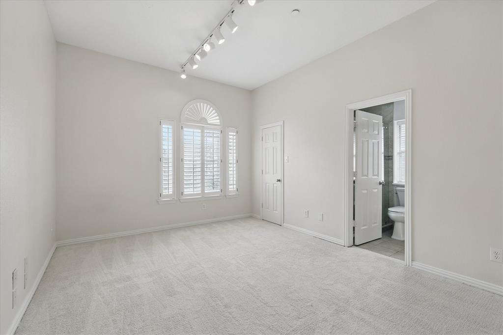 14625 Windsor Court Addison, TX 75001 - Photo 25 of 40 wooden floor in an empty room with a window