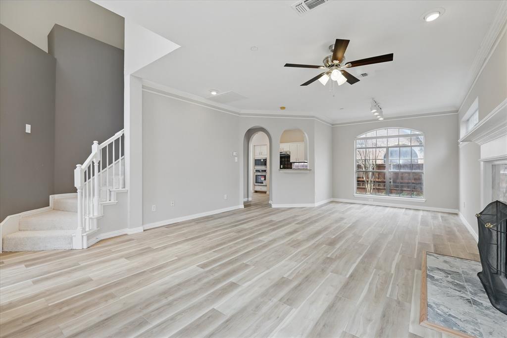 14625 Windsor Court Addison, TX 75001 - Photo 5 of 40 a view of empty room with wooden floor and fan