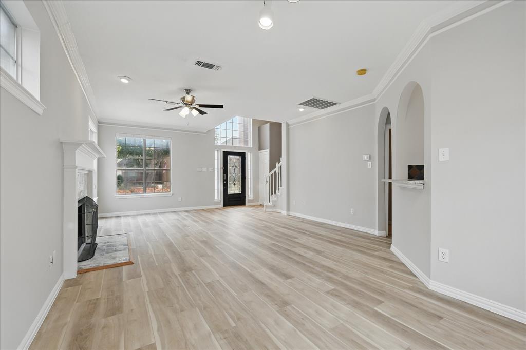 14625 Windsor Court Addison, TX 75001 - Photo 7 of 40 wooden floor in an empty room with a window