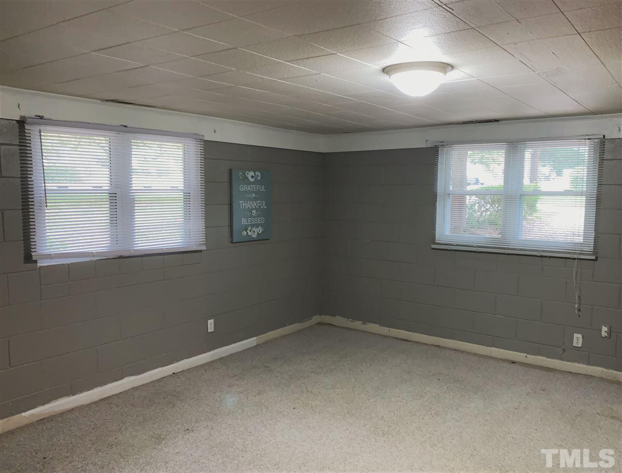 464 Rose Lane Raleigh, NC 27610 - Photo 4 of 5 an empty room with a window