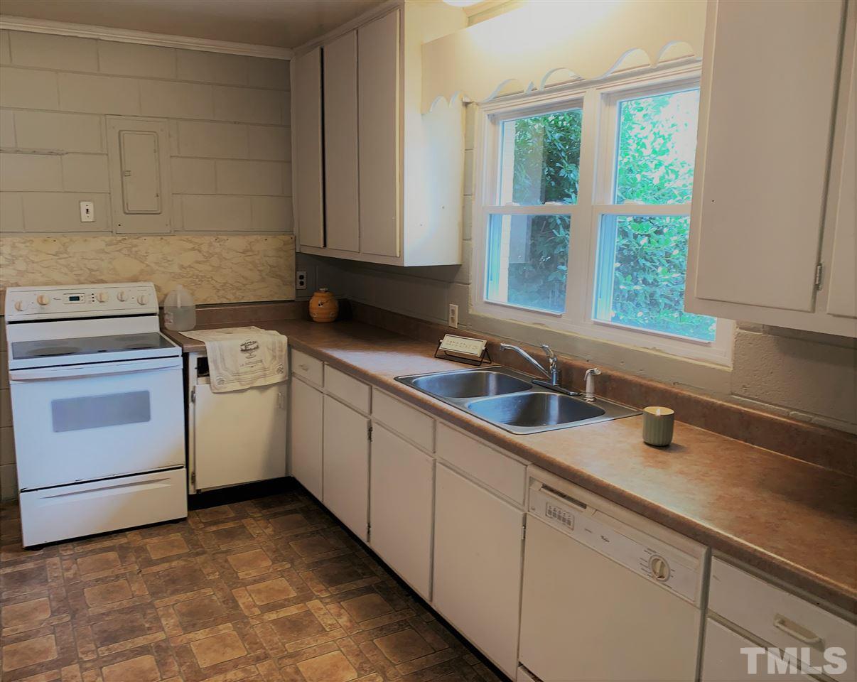 464 Rose Lane Raleigh, NC 27610 - Photo 5 of 5 a kitchen with sink cabinets and window