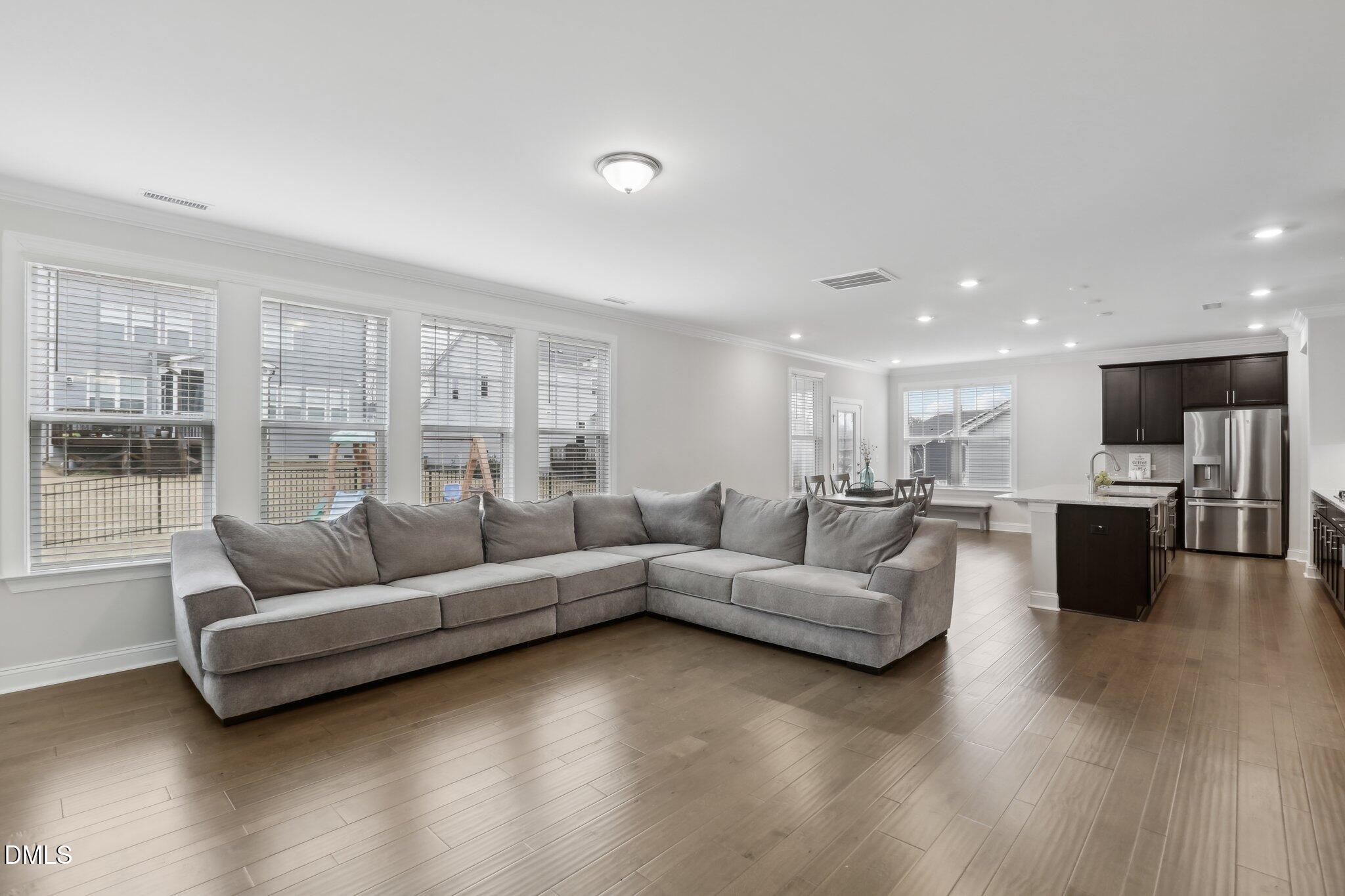 1829 Knights Crest Way Wake Forest, NC 27587 - Photo 11 of 45 a living room with furniture and a large window