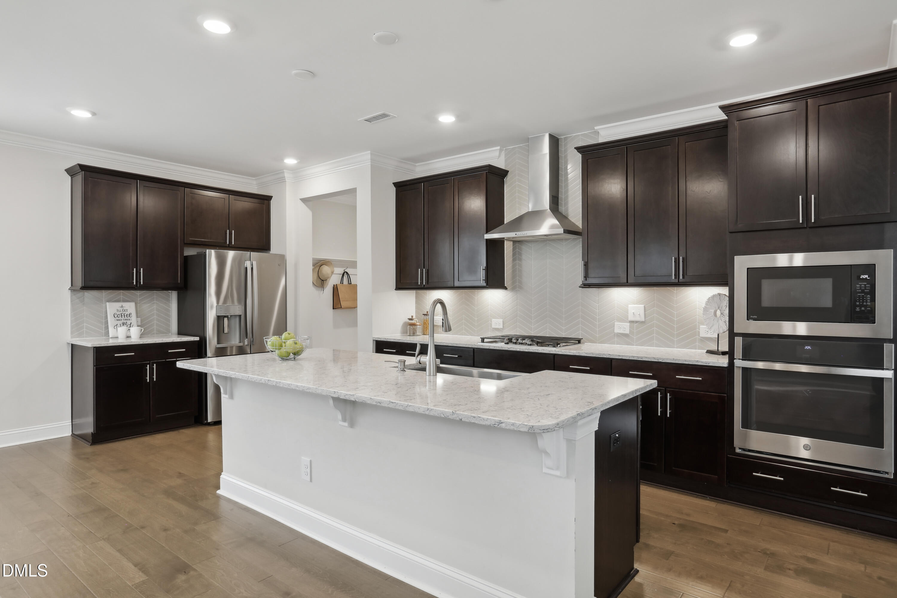 1829 Knights Crest Way Wake Forest, NC 27587 - Photo 12 of 45 a kitchen with stainless steel appliances granite countertop a sink stove and refrigerator