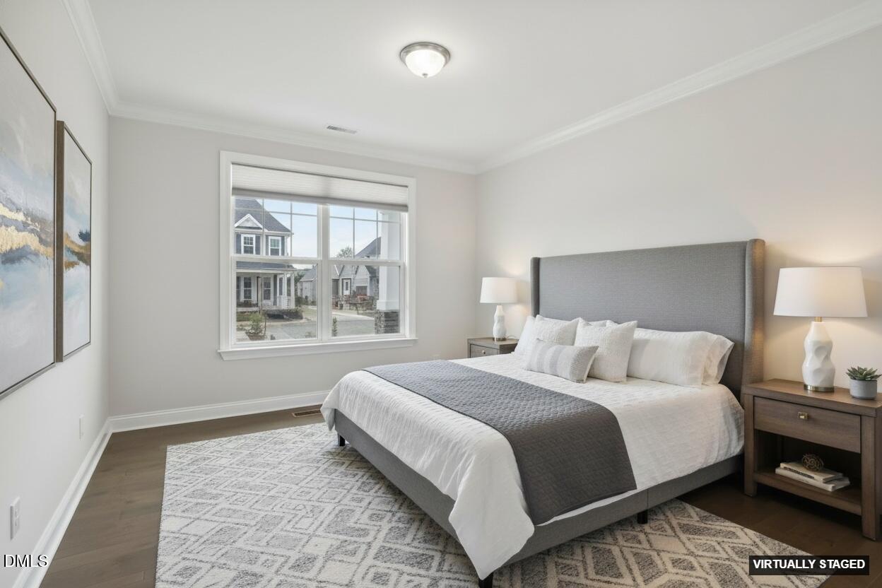 1829 Knights Crest Way Wake Forest, NC 27587 - Photo 19 of 45 a bedroom with a bed and a window