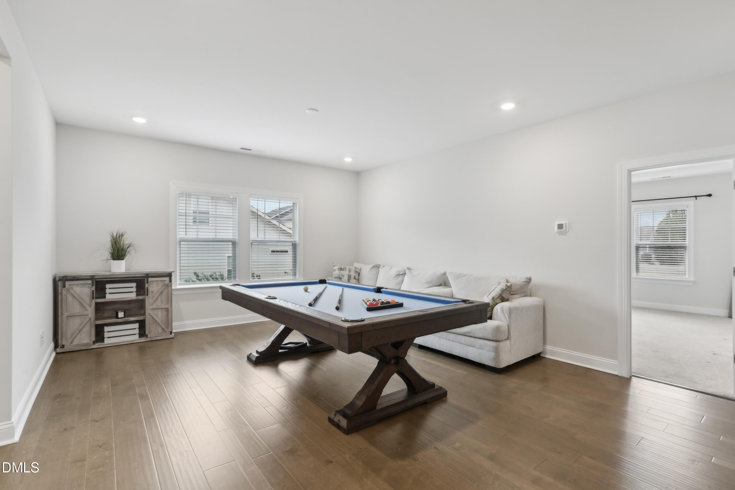 1829 Knights Crest Way Wake Forest, NC 27587 - Photo 24 of 45 a room with furniture and wooden floor