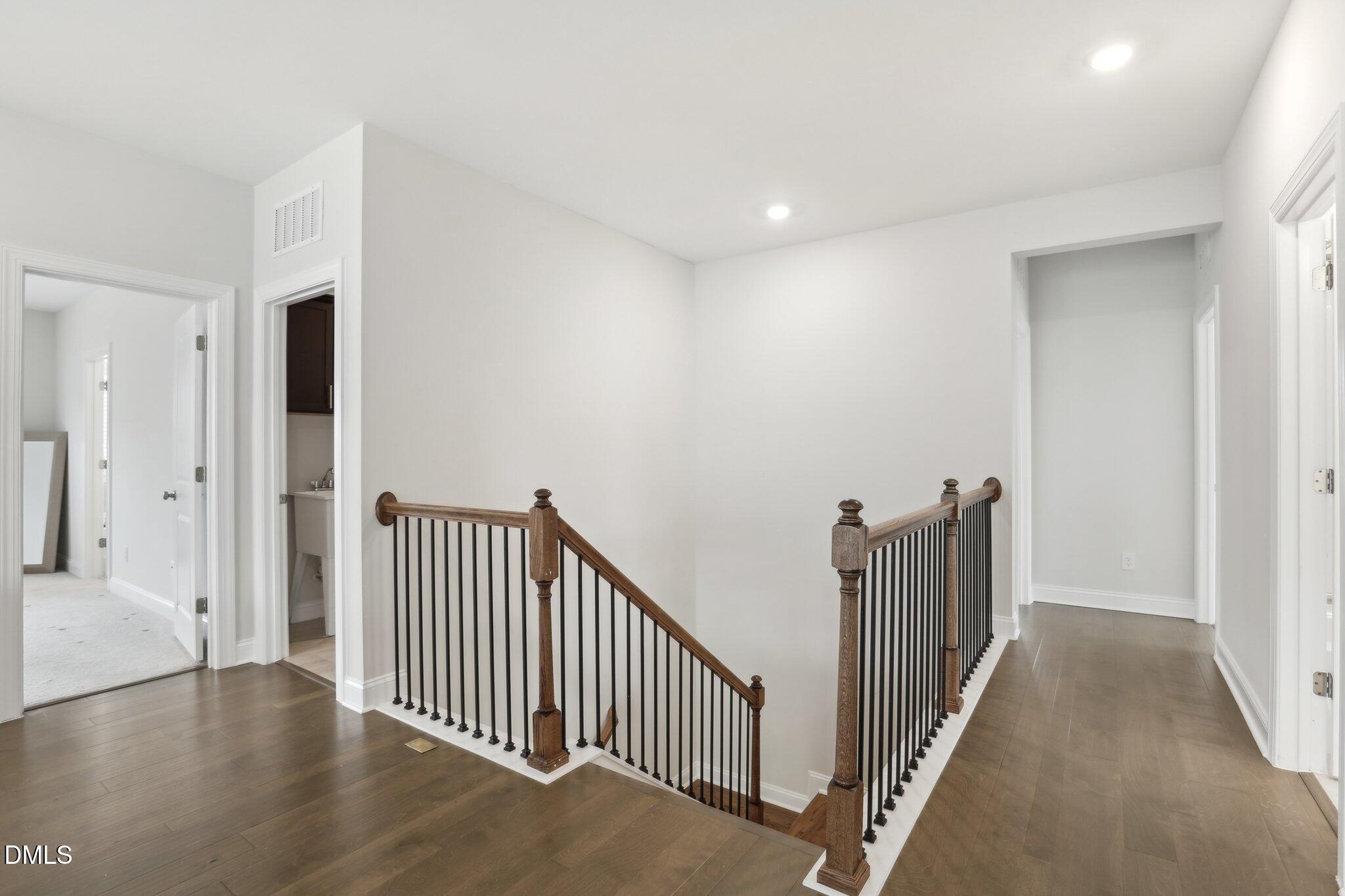 1829 Knights Crest Way Wake Forest, NC 27587 - Photo 33 of 45 a view of a hallway with wooden floor and windows