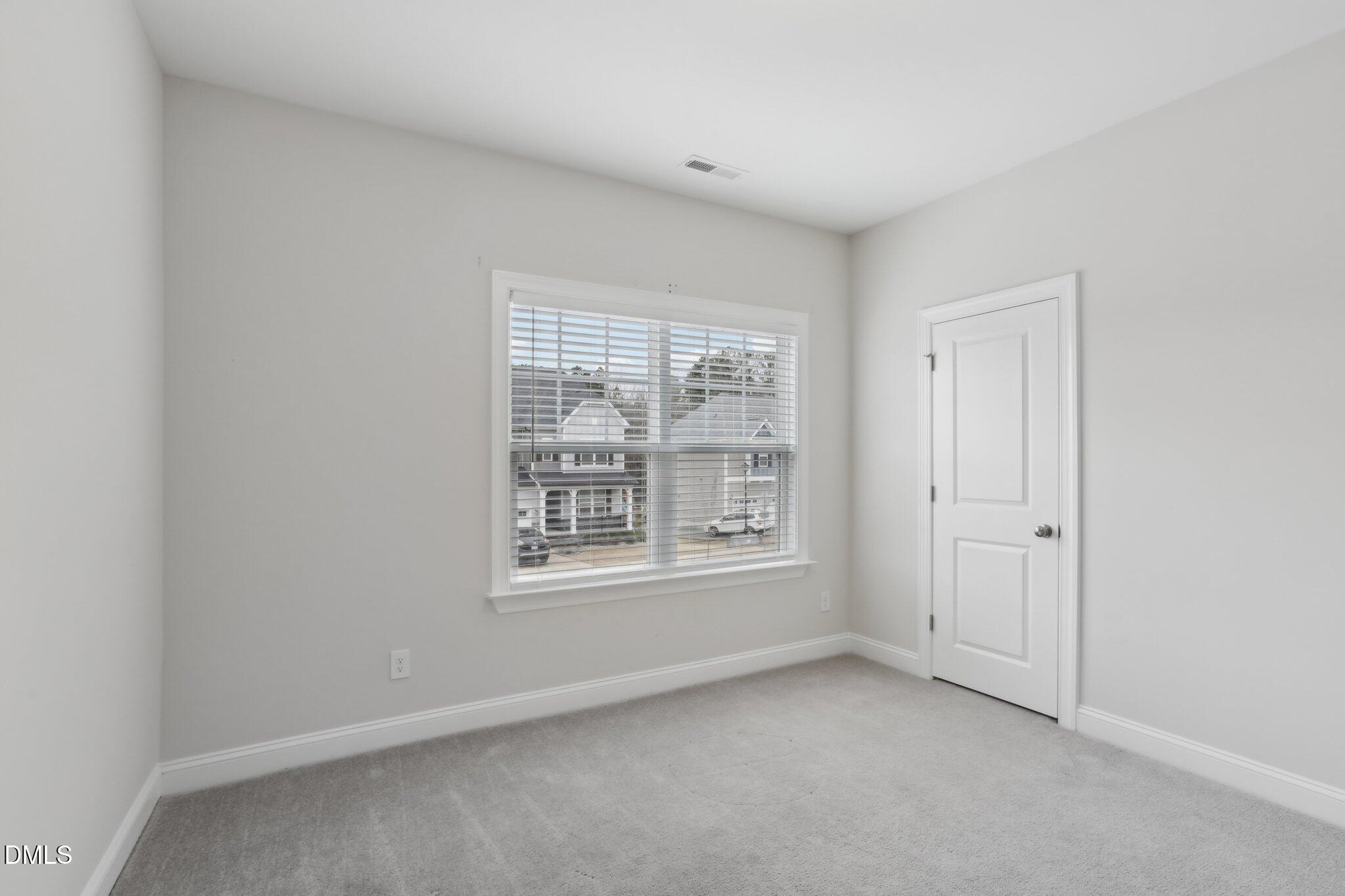 1829 Knights Crest Way Wake Forest, NC 27587 - Photo 34 of 45 an empty room with a window