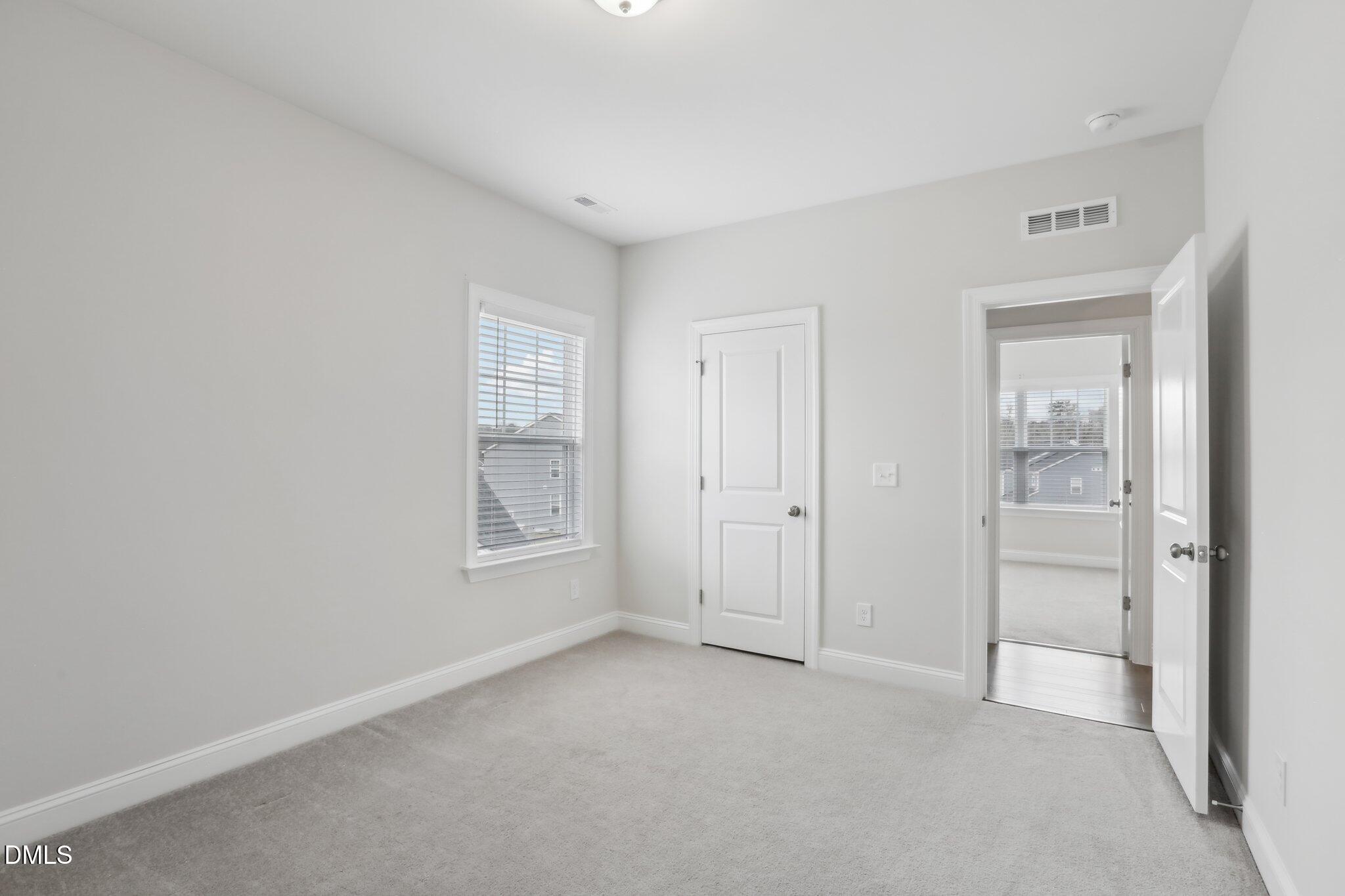 1829 Knights Crest Way Wake Forest, NC 27587 - Photo 35 of 45 an empty room with windows and bathroom