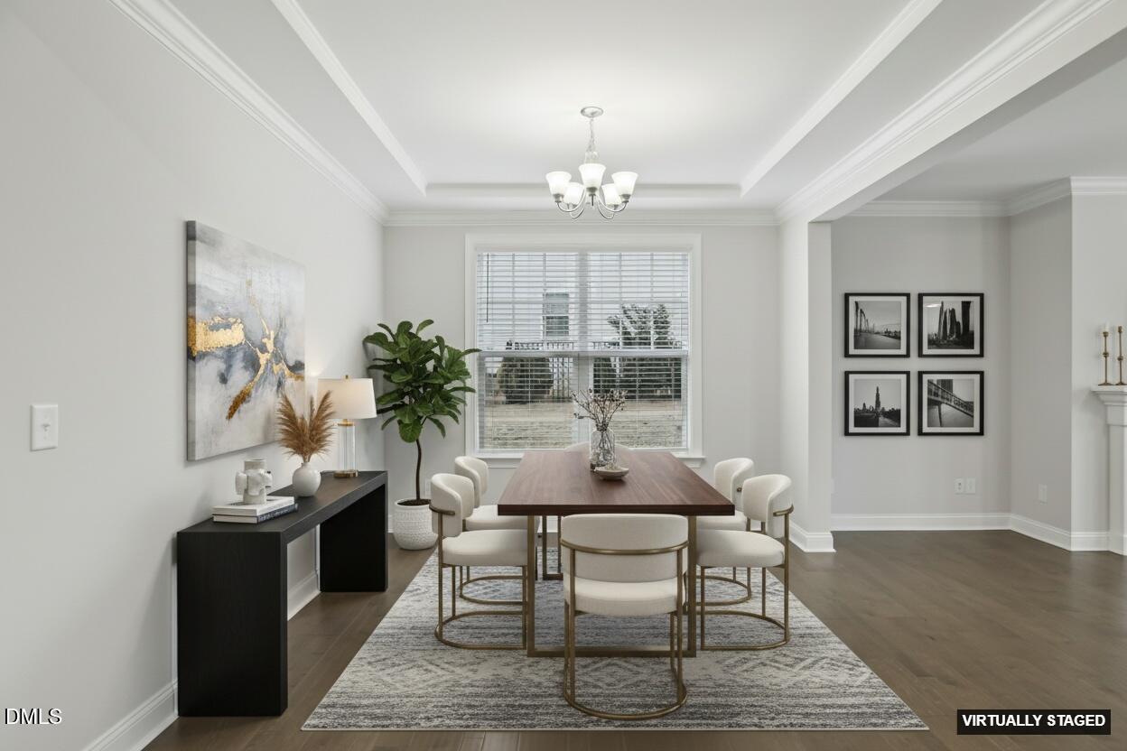 1829 Knights Crest Way Wake Forest, NC 27587 - Photo 5 of 45 a view of a dining room with furniture and wooden floor