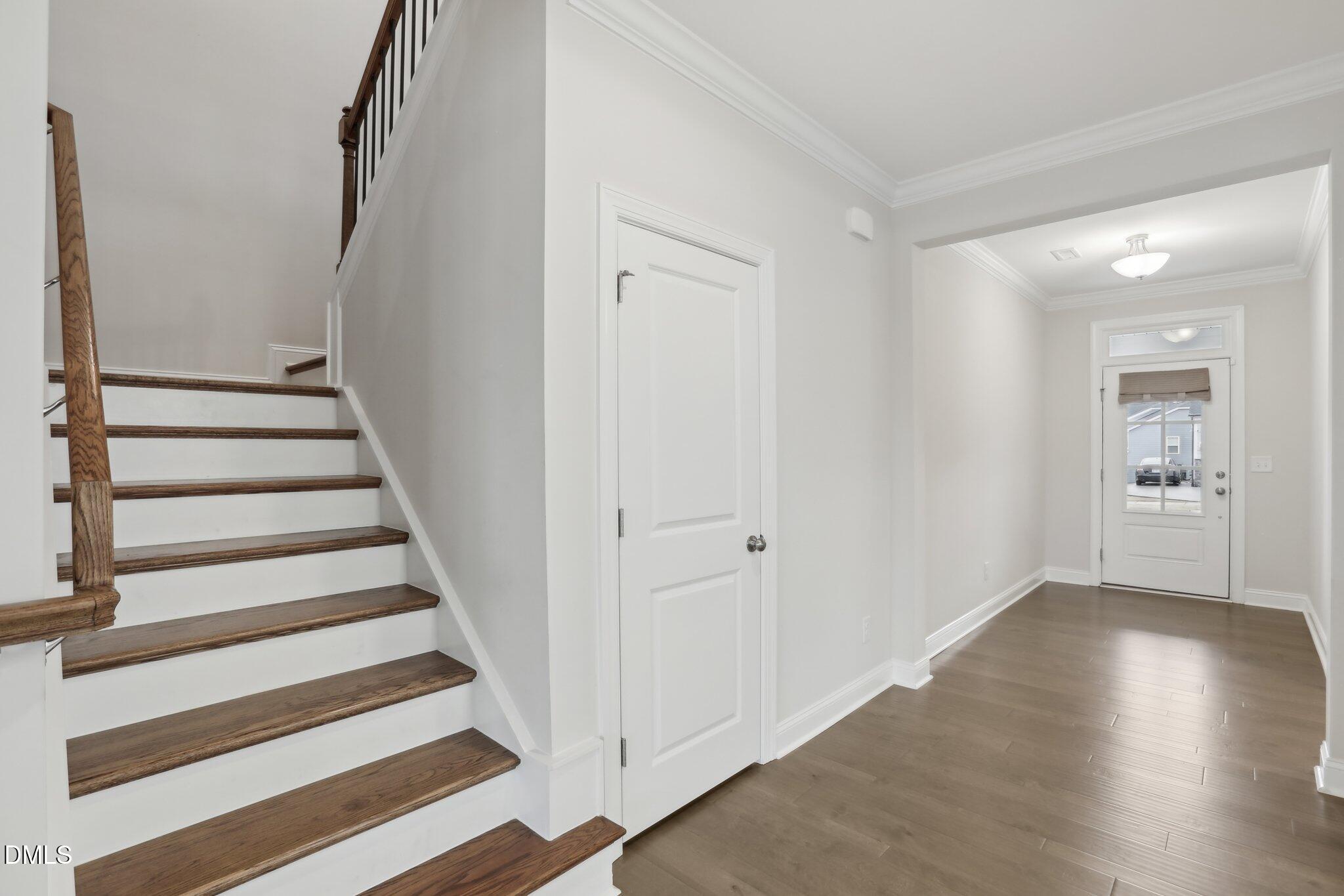 1829 Knights Crest Way Wake Forest, NC 27587 - Photo 7 of 45 a view of entryway with wooden floor and stairs