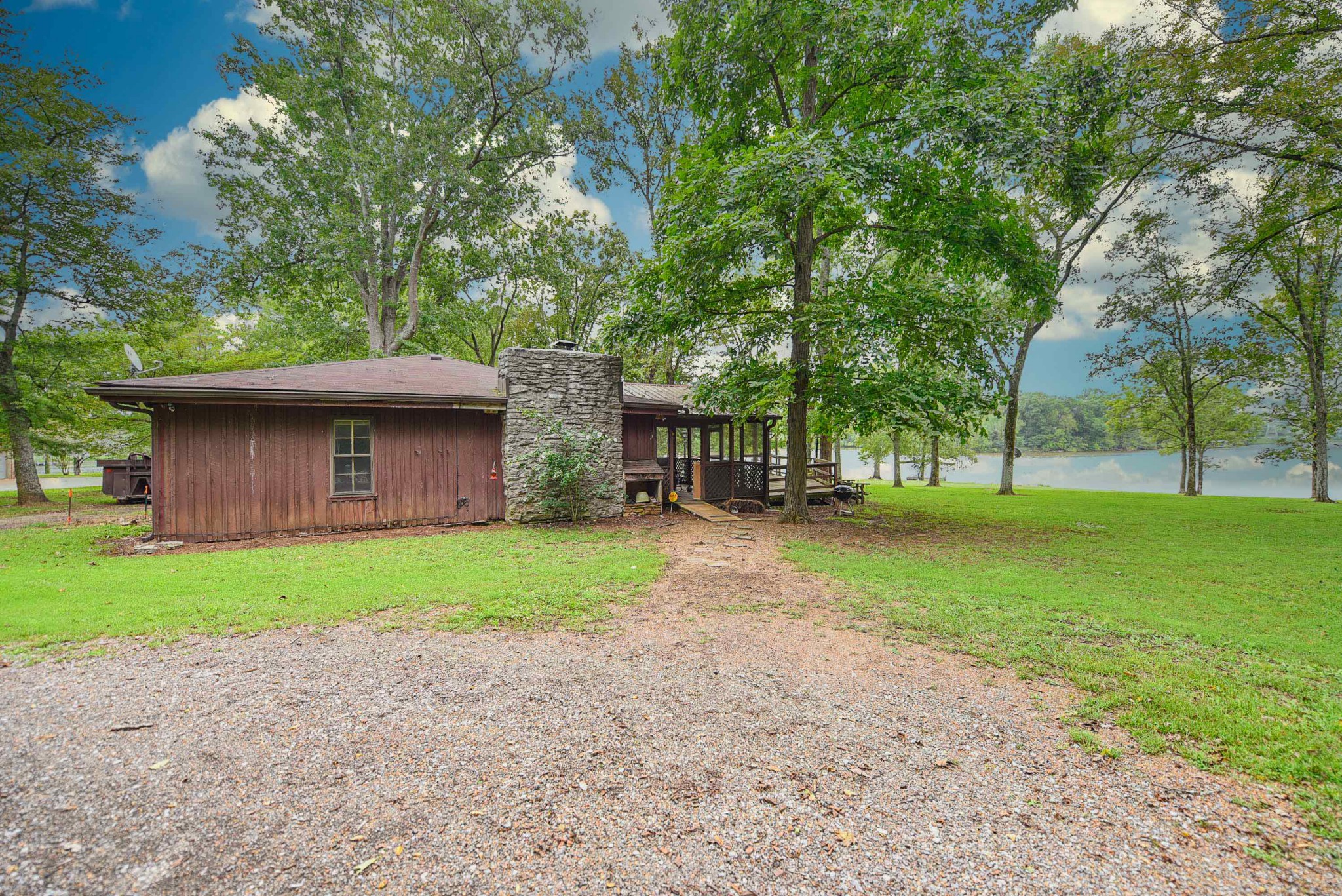 4683 Cairo Bend Road Lebanon, TN 37087 - Photo 8 of 49 a view of a yard with a house and trees in the background