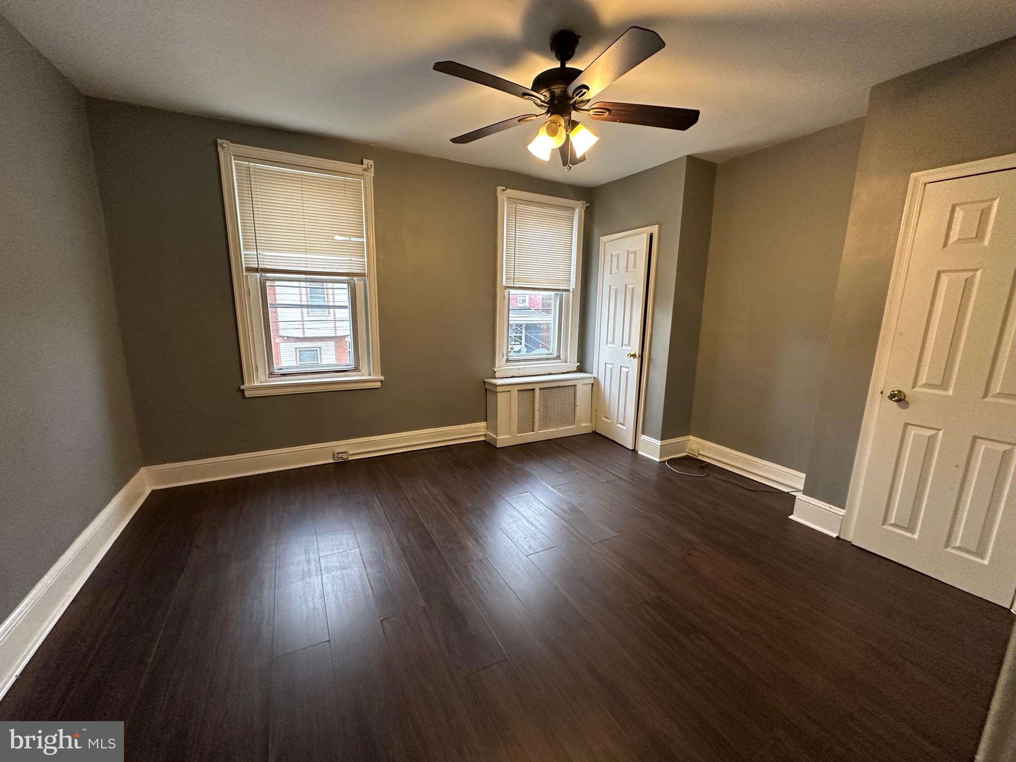 2349 Duncan Street Philadelphia, PA 19124 - Photo 11 of 13 a view of an empty room with wooden floor and a window