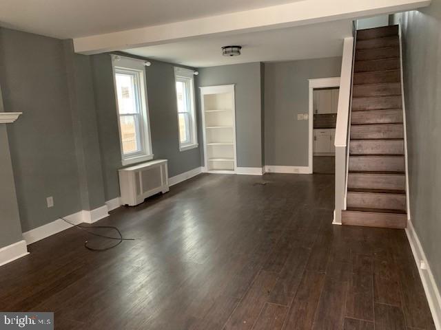 2349 Duncan Street Philadelphia, PA 19124 - Photo 2 of 13 an empty room with wooden floor and windows