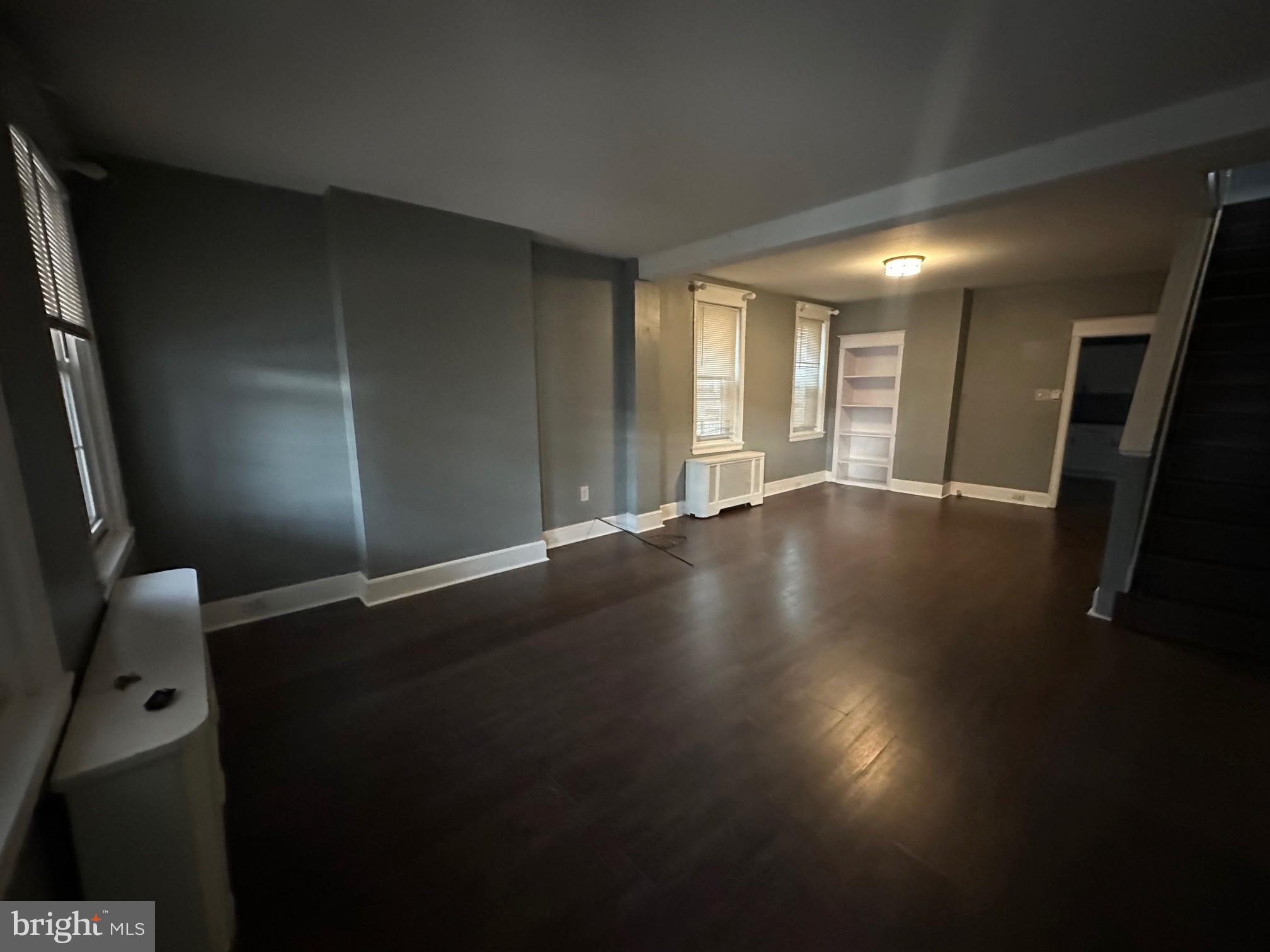 2349 Duncan Street Philadelphia, PA 19124 - Photo 3 of 13 an empty room with wooden floor and windows